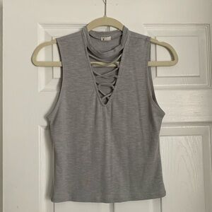 Gray crop top from Garage. Size medium. Criss cross detail in front, deep v